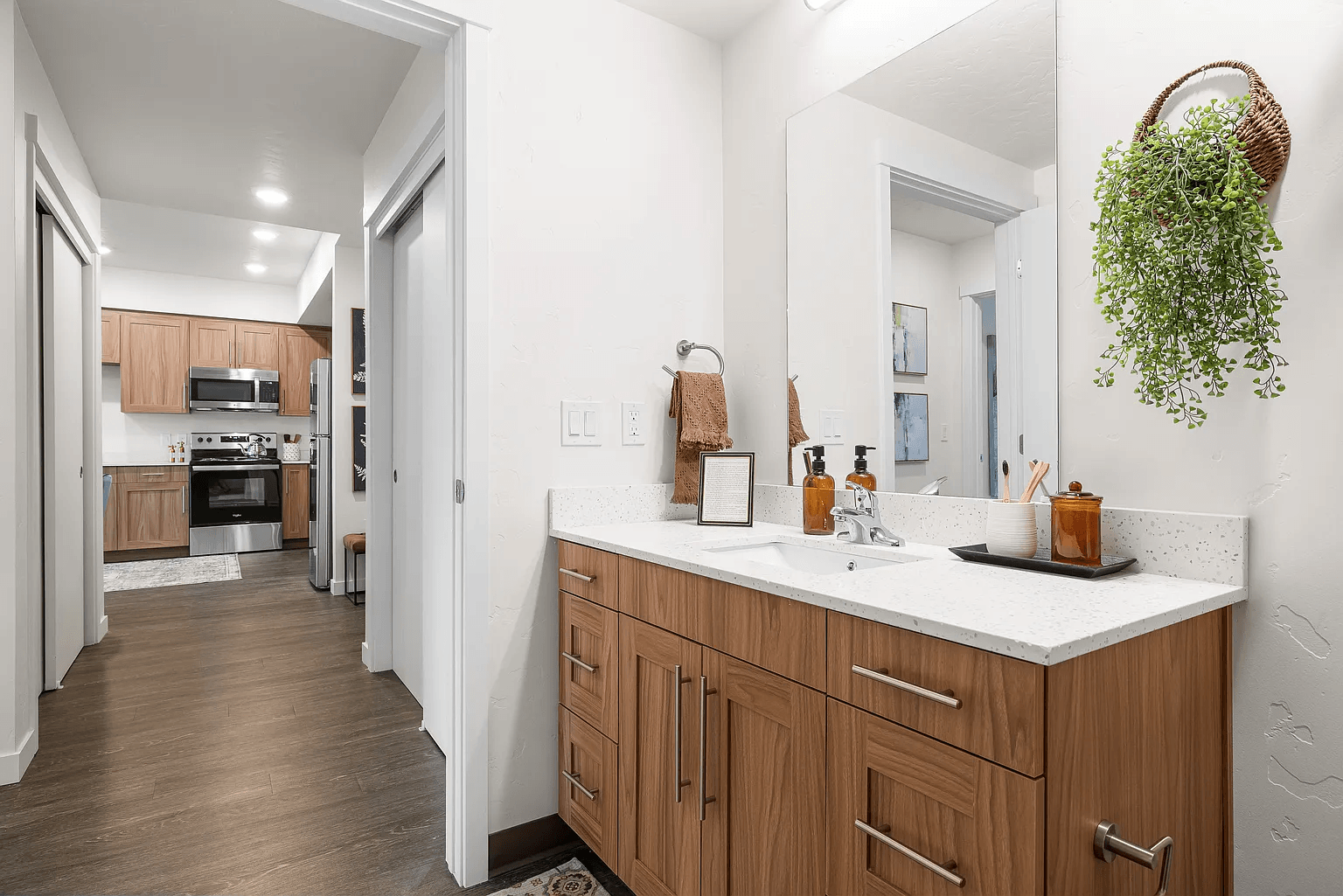 A kitchen with wooden cabinets and a white counter.